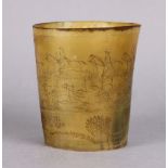 A 19th century horn beaker, all over engraved with a busy hunting scene, 4½” high x 4” dia.