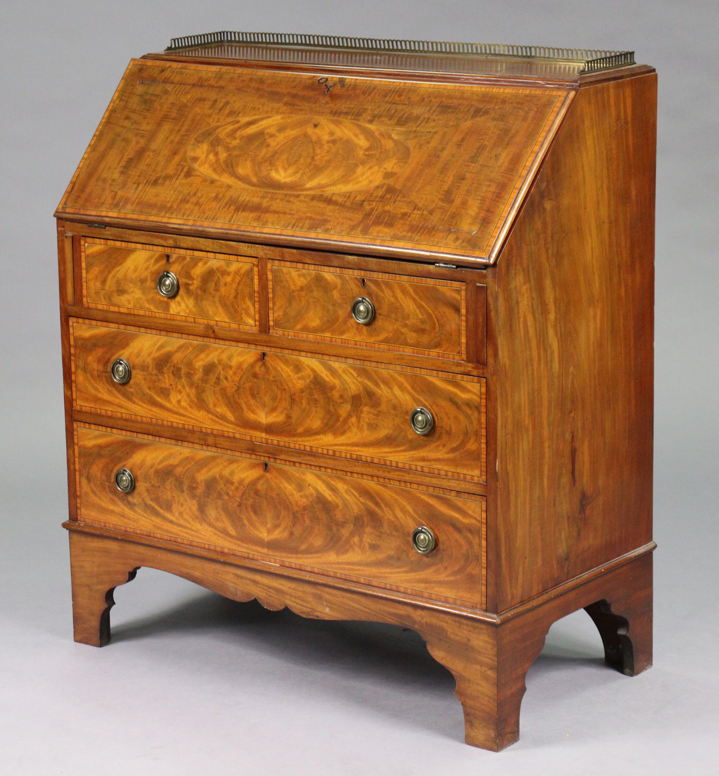 A 19th century mahogany & satinwood crossbanded bureau, the top with pierced brass gallery above a f