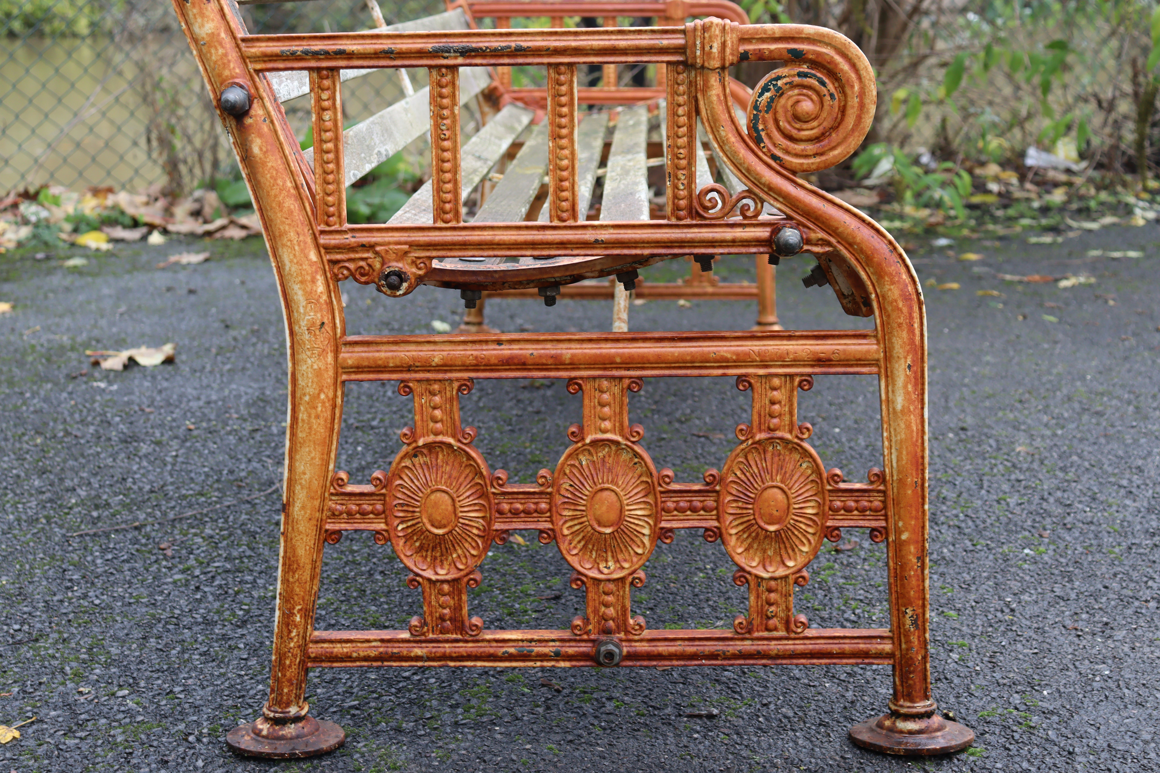 A 19th century Coalbrookdale cast iron garden bench, the pierced ends of Neoclassical design with - Image 7 of 10