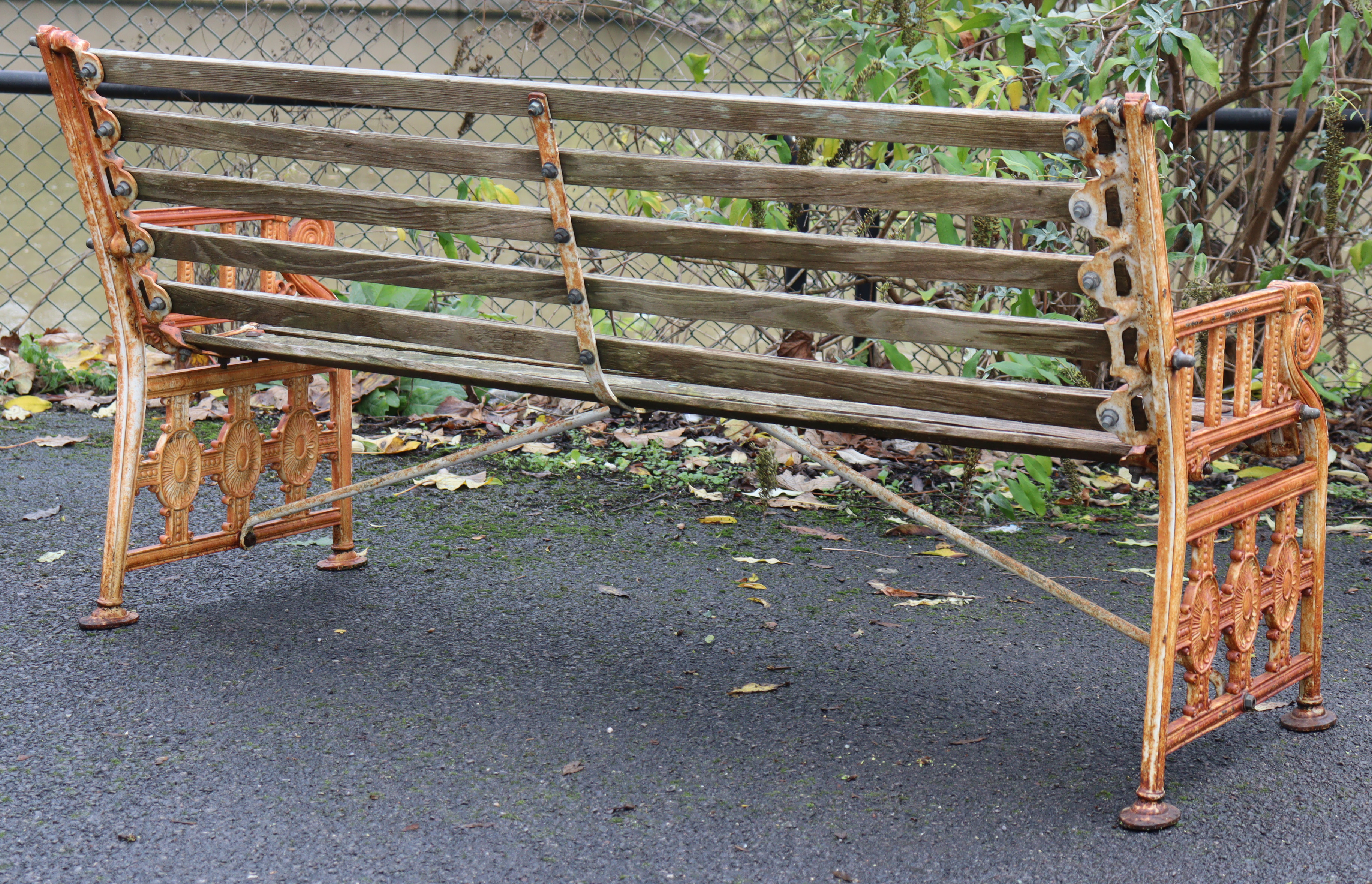 A 19th century Coalbrookdale cast iron garden bench, the pierced ends of Neoclassical design with - Image 8 of 10