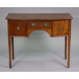 A Georgian mahogany bow-front sideboard, with cupboard either side of a central frieze drawer with