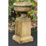A Doulton Lambeth stoneware garden urn, with egg-&-dart border & gadrooned body, on square foot &