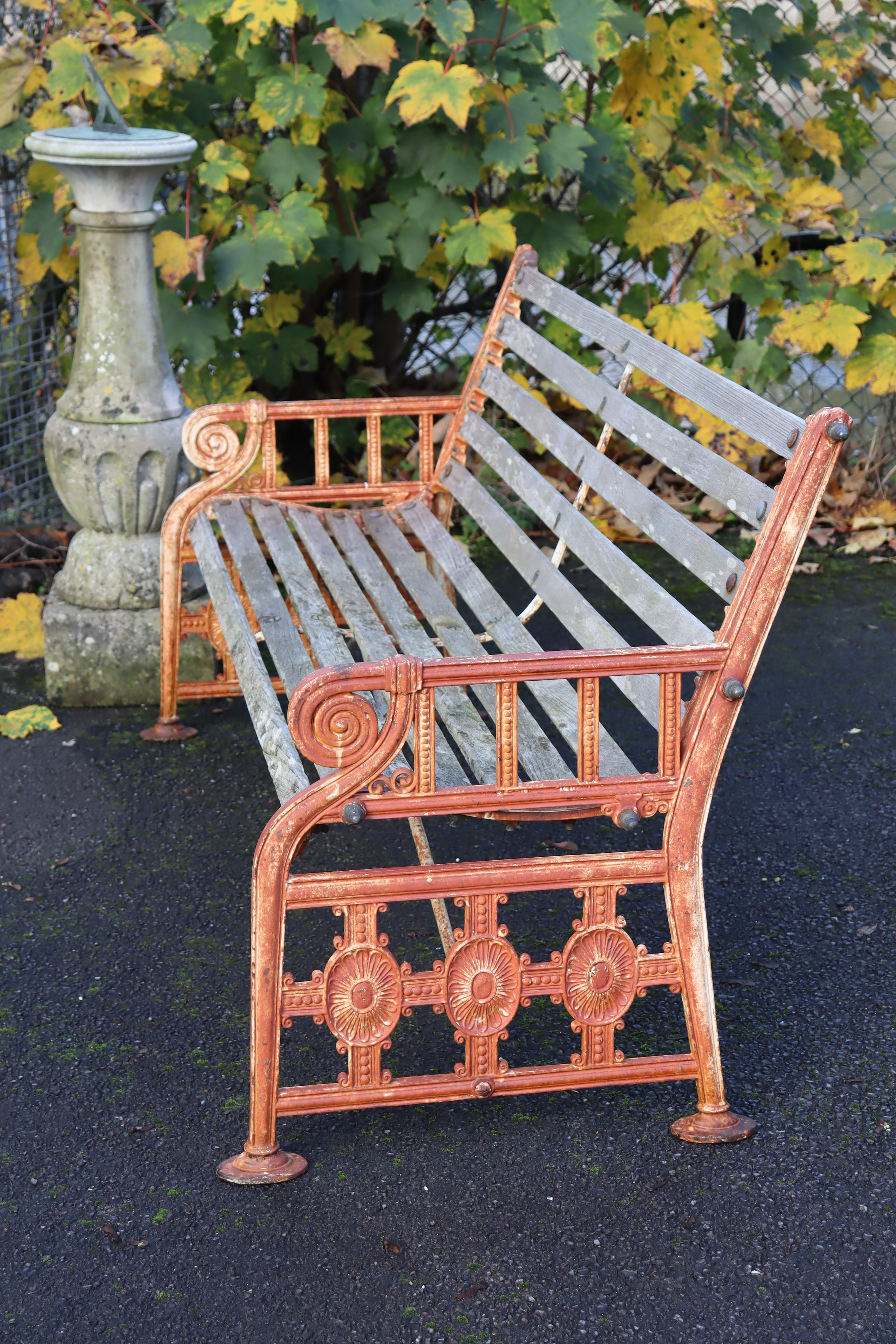 A 19th century Coalbrookdale cast iron garden bench, the pierced ends of Neoclassical design with - Image 2 of 10