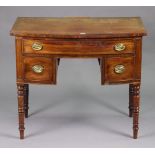 A 19th century mahogany bow-front knee-hole sideboard fitted with an arrangement of four