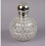 A late Victorian silver-mounted large cut-glass spherical toilet water bottle with plain silver