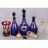 A 19th century blue glass “Brandy” decanter with gilt painted decoration and flat-sided pear-