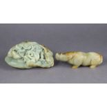 A Chinese pale green & russet jade boulder, relief-carved with a figure in a cave, 7” x 4”; & a