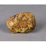 A Chinese mottled green & russet jade pendant carved in relief with mice & bats encircling cash