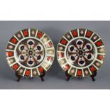 A pair of Royal Crown Derby Old Imari pattern porcelain 10½” plates, each marked “1128, XLVI” & “