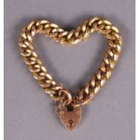 A 9ct. gold curb-link bracelet with padlock clasp & safety chain. (14.5.gm).