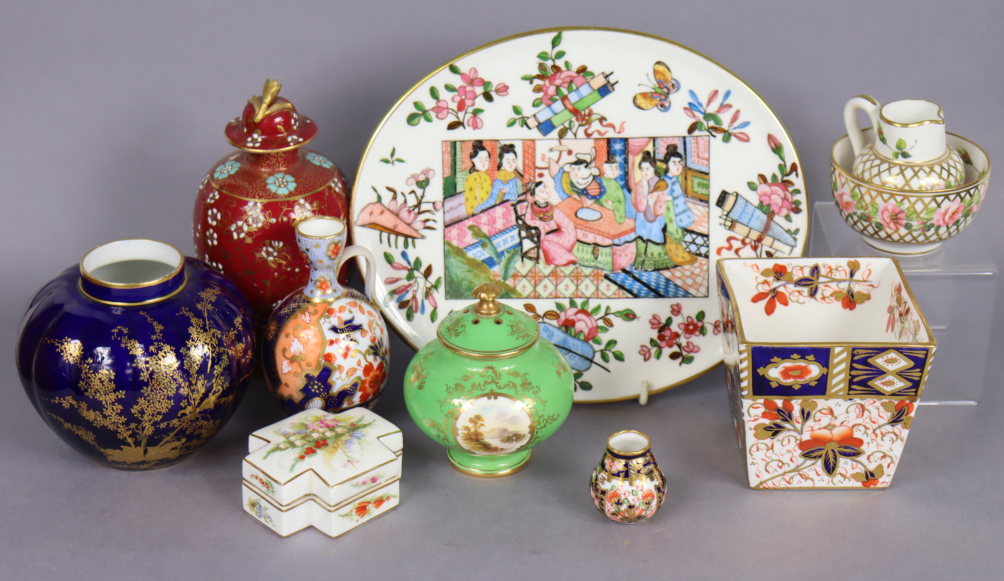 A Coalport squat round green-ground vase & cover with painted landscape by E. Ball, 3½” (hairline