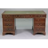 A Victorian mahogany large pedestal desk inset gilt-tooled green leather writing surface to the