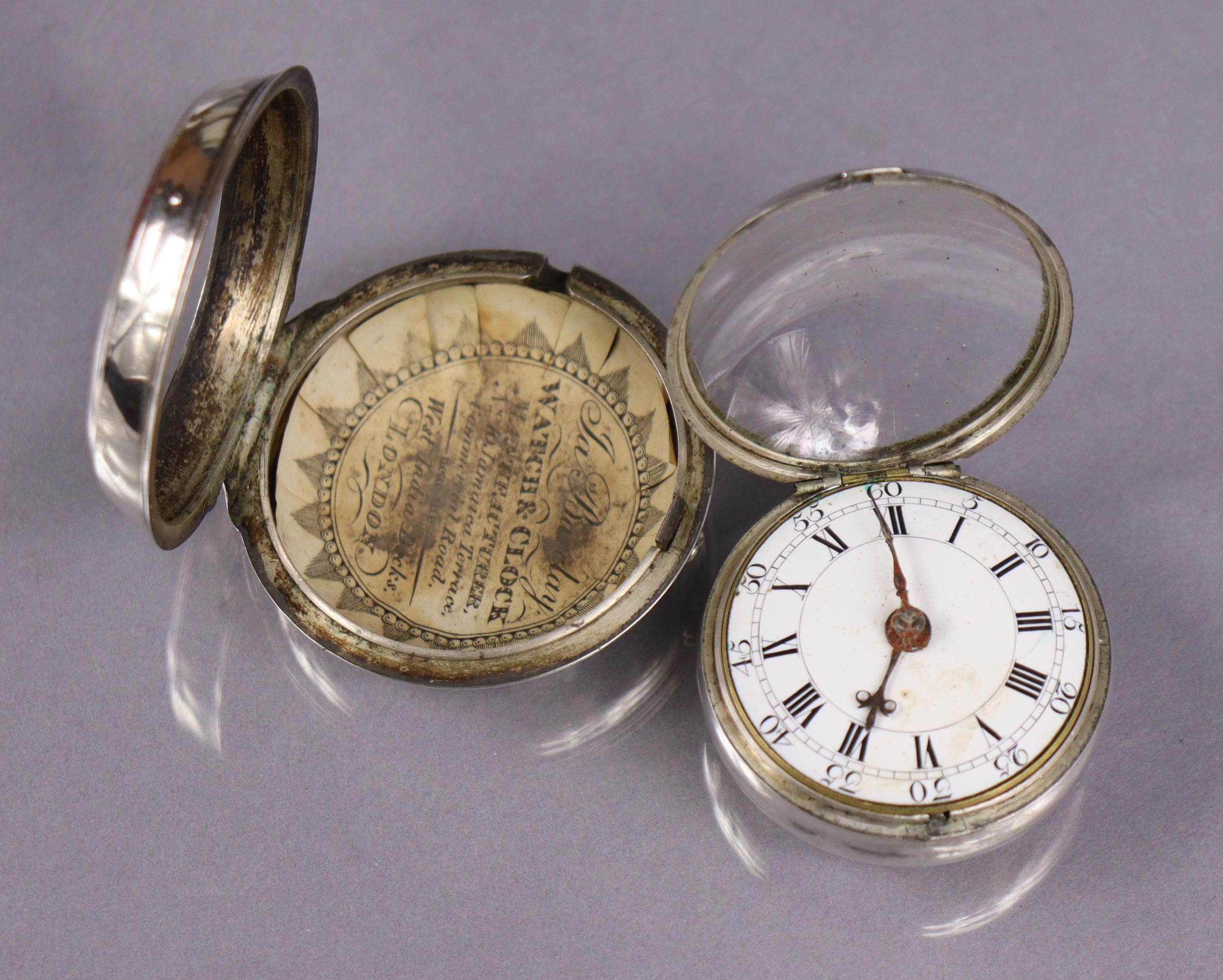 An 18th century silver pair-cased pocket watch, the convex white enamel dial with black roman