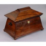 A 19th century rosewood work box of sarcophagus form, the hinged lid enclosing felt-lined