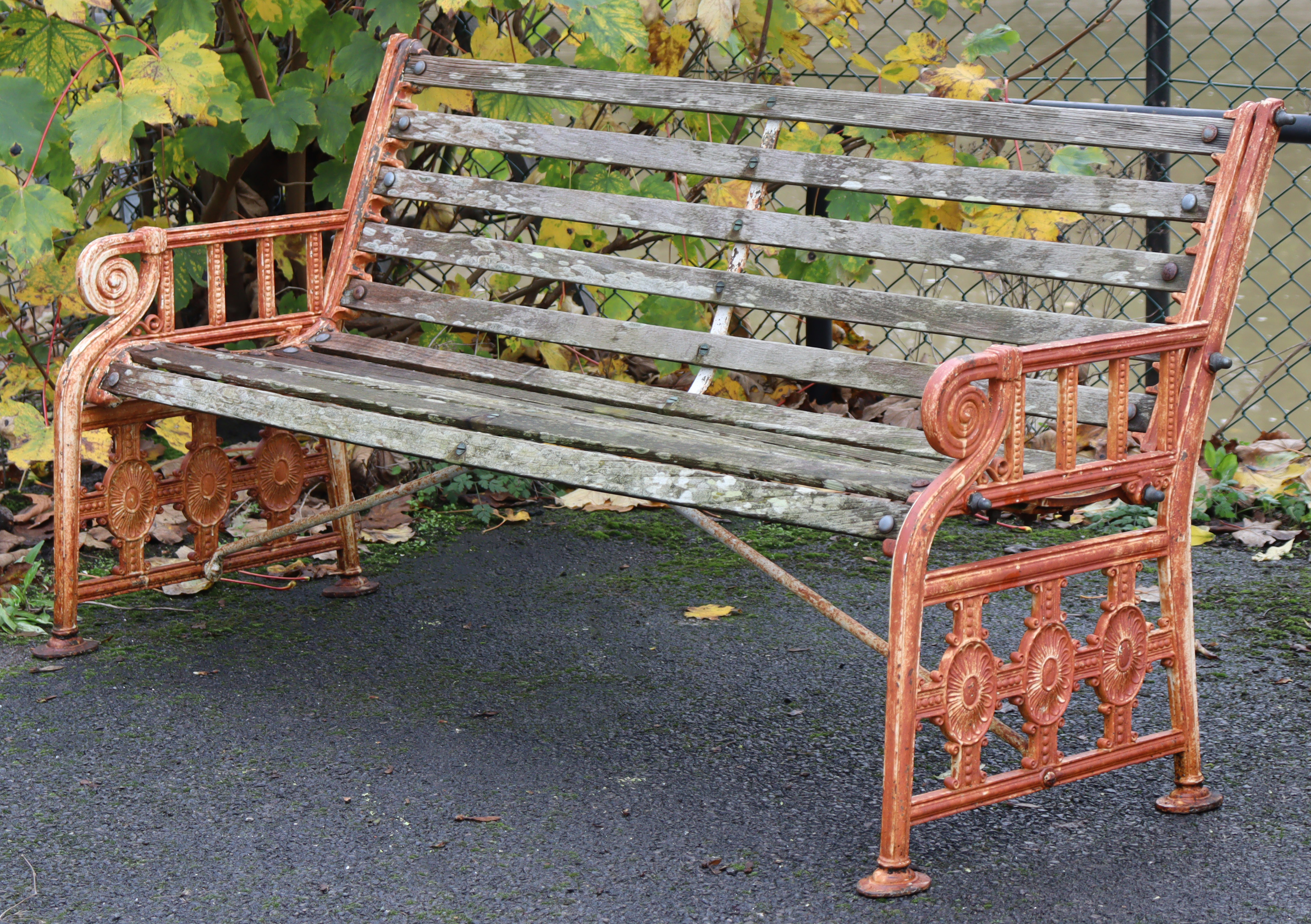 A 19th century Coalbrookdale cast iron garden bench, the pierced ends of Neoclassical design with