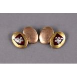 A pair of 9ct. gold oval-panel cuff-links, each with coloured enamel coat-of-arms. (9.9gm).