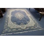 An Aubusson-style carpet of pastel blue ground, with central floral medallion in multiple cream foli