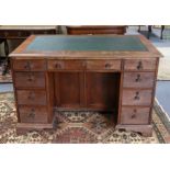 A Victorian mahogany kneehole desk inset gilt-tooled green leather to the top, fitted with an