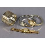 Three various ladies’ bracelet watches; & a heavy plain silver cylindrical napkin ring, Chester