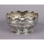 A Victorian silver monteith-shaped small bowl with embossed decoration of husk-swags & acanthus