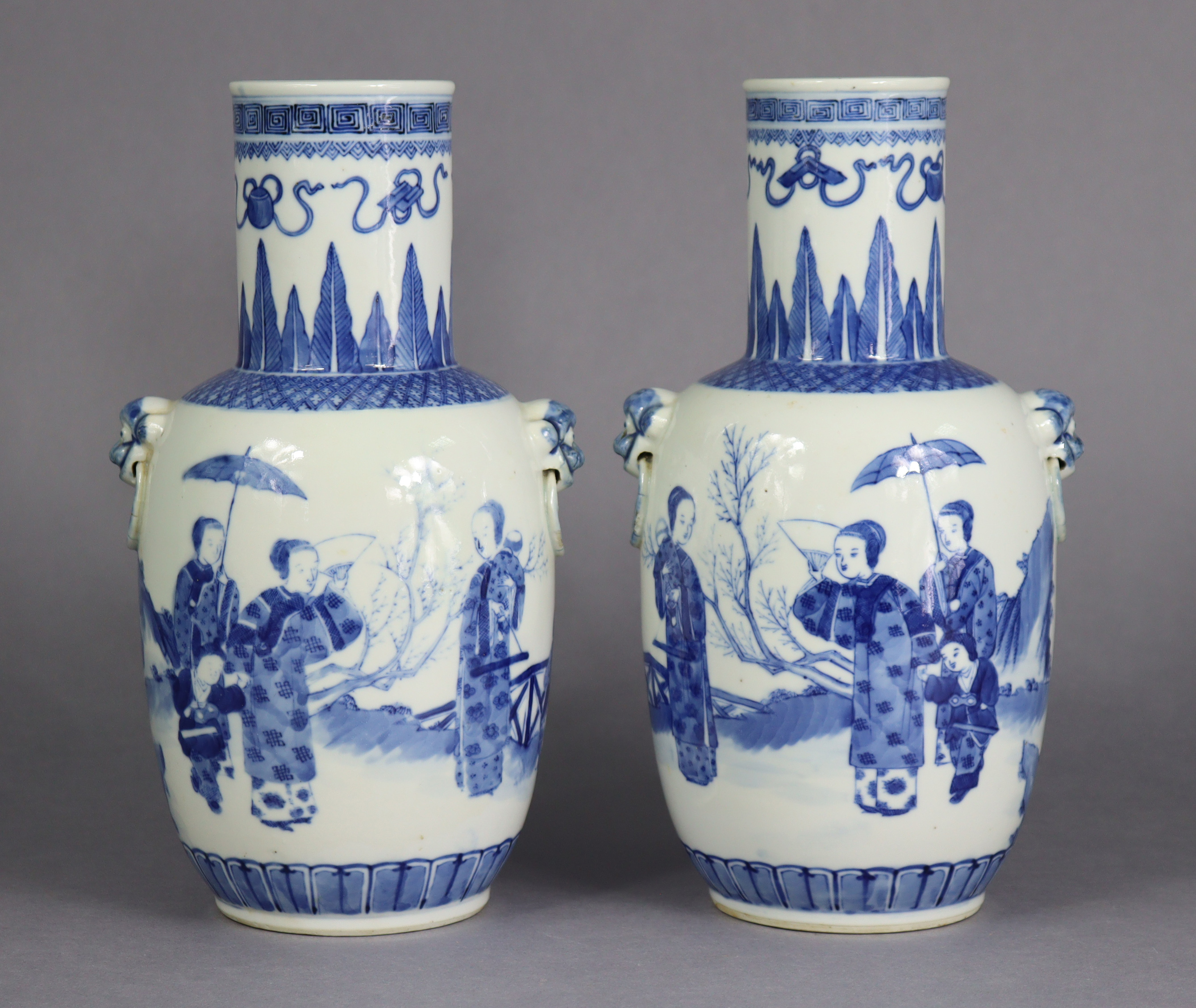 A pair of 19th century Chinese blue & white porcelain vases of ovoid form, with tall cylindrical