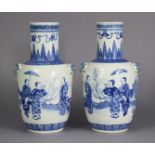 A pair of 19th century Chinese blue & white porcelain vases of ovoid form, with tall cylindrical