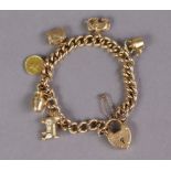 A 15ct. gold curb-link bracelet with padlock clasp, & five various 9ct. gold pendant charms & a