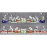 Eight pairs of continental porcelain small models of cats & dogs, some with their young, in the