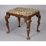 A late 19th/early 20th century walnut Queen Anne-style stool with padded drop-in seat upholstered