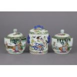 A Chinese porcelain small cylindrical jar & cover decorated in famille verte enamels, the ribbed