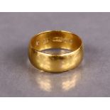 A 22ct. gold plain wedding band; Birmingham hallmarks for 1896; size: O, weight: 6.7gm.