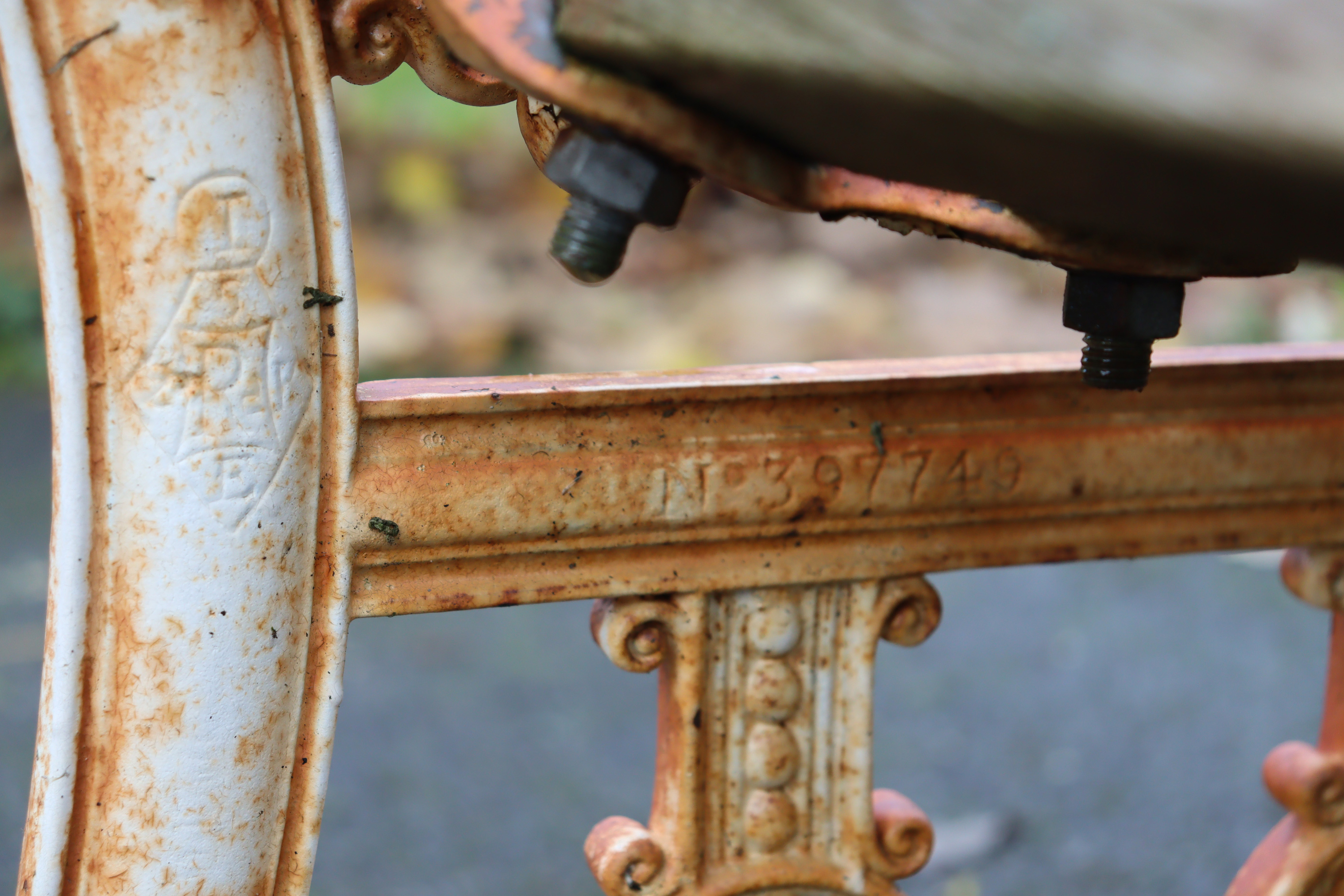 A 19th century Coalbrookdale cast iron garden bench, the pierced ends of Neoclassical design with - Image 9 of 10