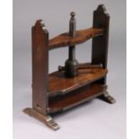 A 19th century mahogany book press on shaped supports with pierced handles, 21” wide x 25” high x