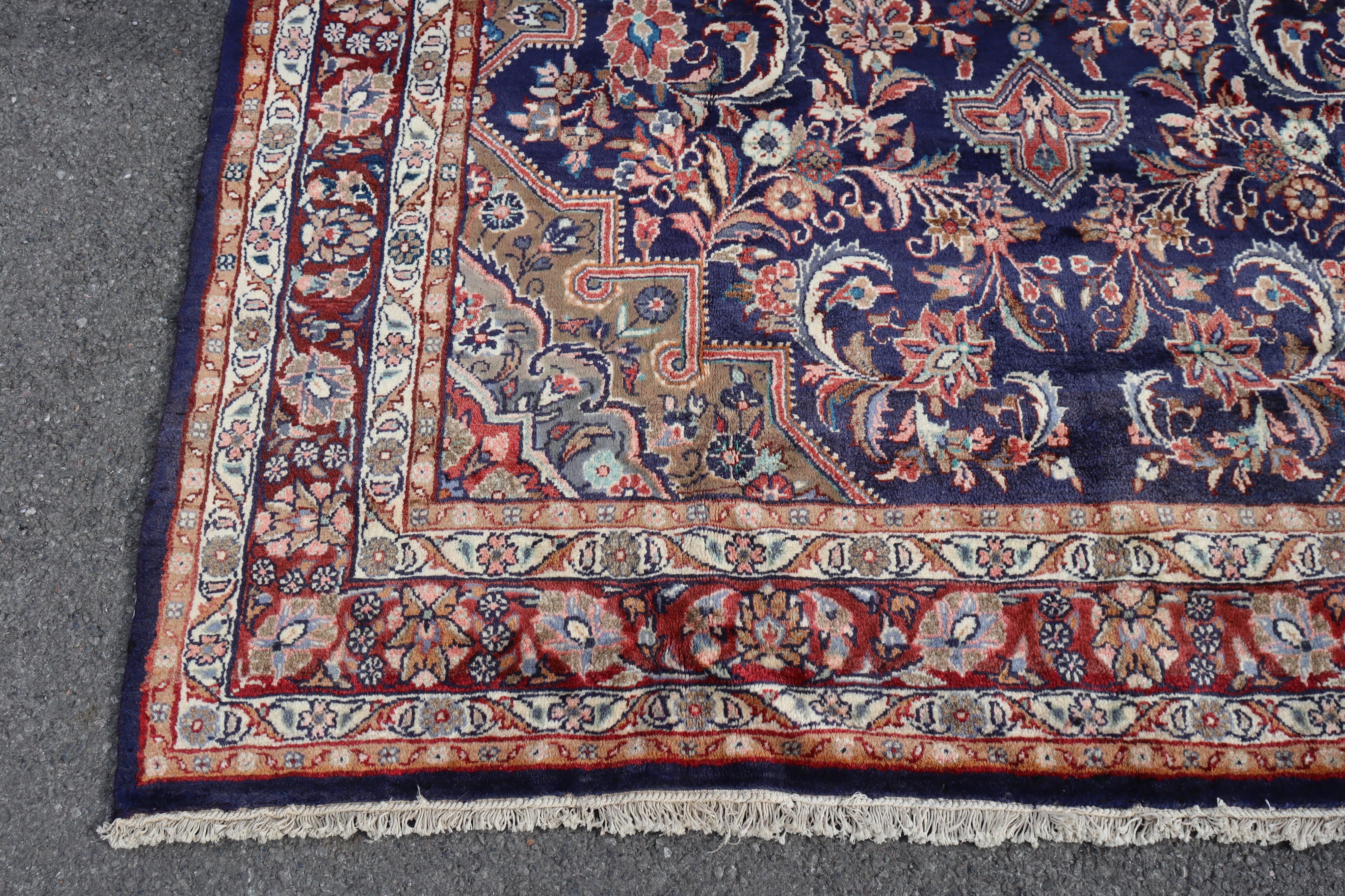 A North West Persian Hamadan rug of madder ground with geometric floral designs surrounded by narrow - Image 2 of 3