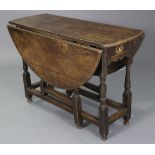 A 17th century oak gate-leg table, fitted frieze drawer to one end, with shaped apron, half-round