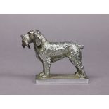 A silvered metal car mascot in the form of a standing retriever with gamebird in it mouth, 3½”