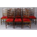 A set of eight ladder-back dining chairs (including one carver) with padded drop-in-seats, & on