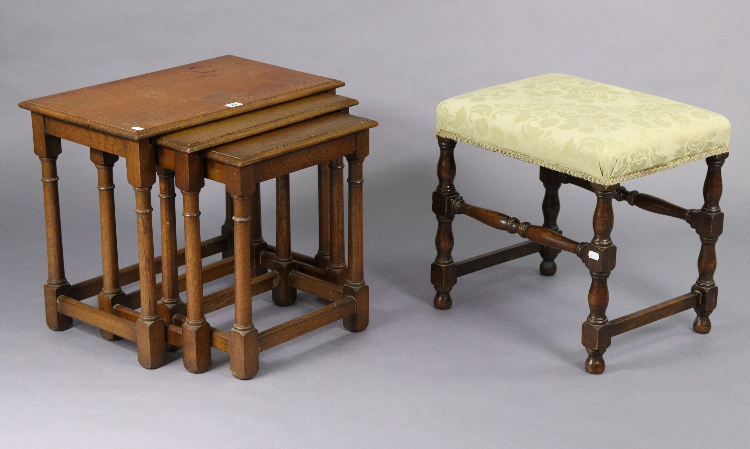 An oak nest of three rectangular occasional tables each table on four baluster-turned supports