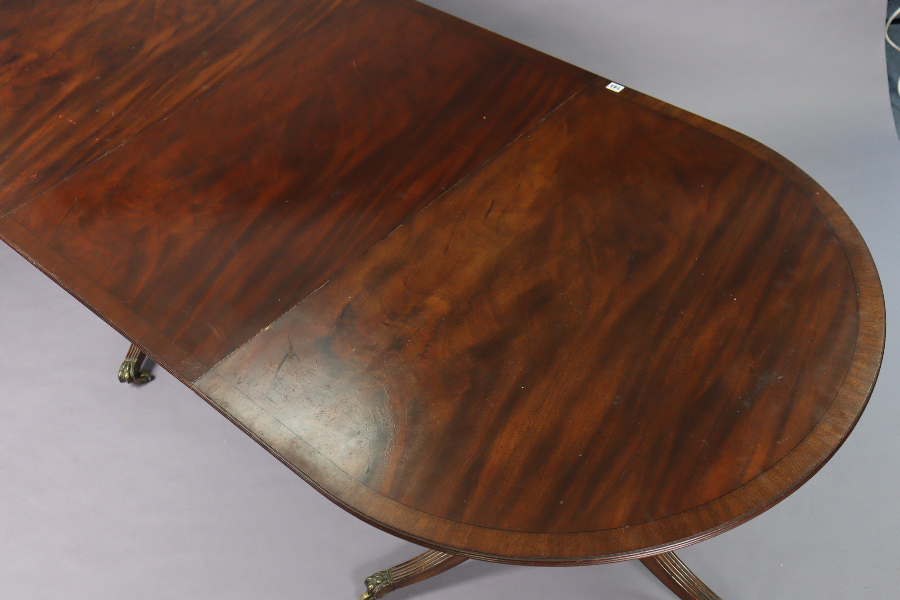 A regency-style inlaid-mahogany twin-pedestal tilt top extending dining table with d-shaped ends, - Image 4 of 9