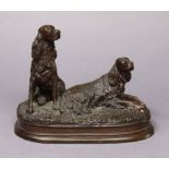 A bronzed metal ornament in the form of two retrievers after Mene, on plinth base, 10” wide x 8¼”