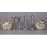 A pair of George V silver spill vases, 5¼” high Chester 1920; a pair of silver candlesticks, 5¾”