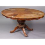 A Victorian walnut pedestal dining table with a moulded edge to the oval tilt-top, & on a vase