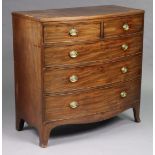 A Regency mahogany bow-front chest of two short & three long graduated drawers, with brass oval