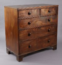 A 19th century mahogany chest fitted two short & three long graduated drawers with tuned knob