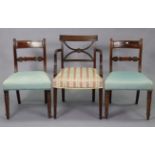 An early 20th century mahogany bow-back carver dining chair with a padded seat, & on fluted square