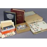 A collection of British Commonwealth stamps in a ring-binder album; two albums & contents of World