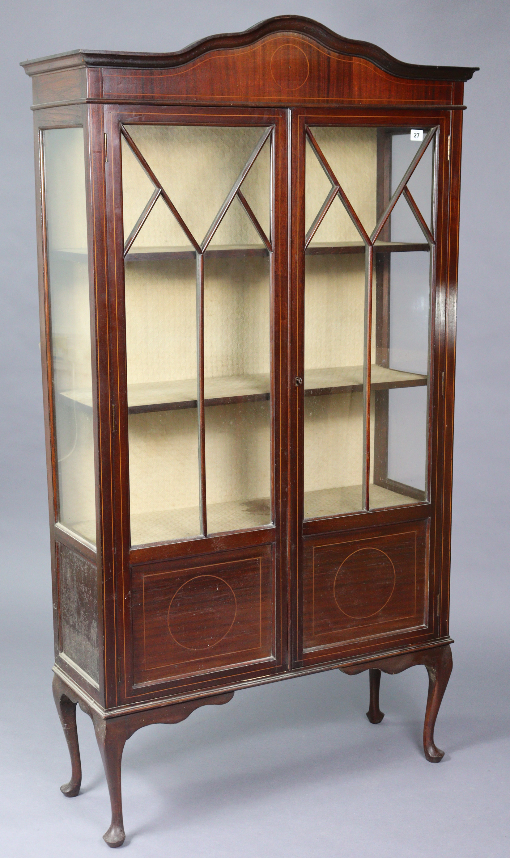 An Edwardian inlaid-mahogany tall china display cabinet fitted three shelves enclosed by a pair of