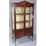 An Edwardian inlaid-mahogany tall china display cabinet fitted three shelves enclosed by a pair of