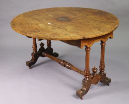 A 19th century birds-eye-maple circular drop-leaf dining table on pair of turned supports to