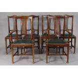 A set of six Edwardian mahogany splat-back dining chairs (including a pair of carvers) with padded